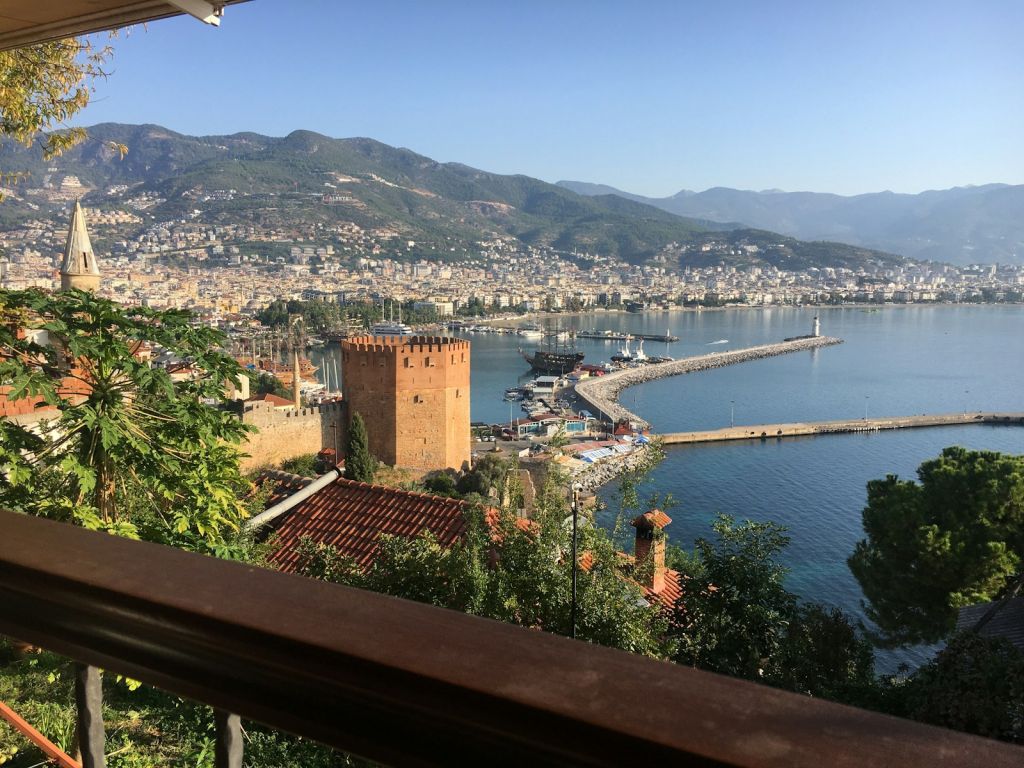 a building next to a body of water
